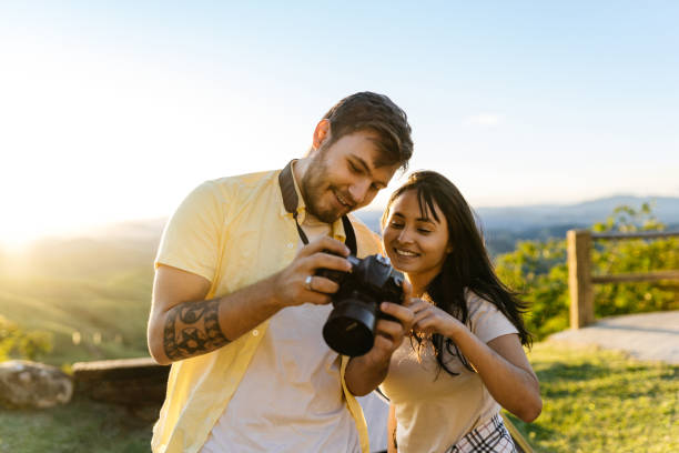 istock Couple looking at photos taken on camera 1312704482
