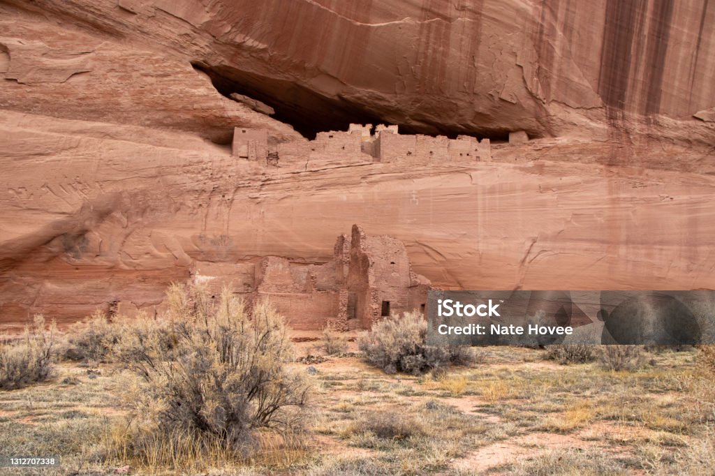 Old Native American Settlement on Cliff Historic "White House" Native American Ruins on Rocky Ledge in Canyon de Chelly National Monument (Winter)- Navajo Nation, Arizona, USA Canyon de Chelly Stock Photo