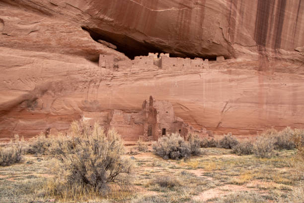 Old Native American Settlement on Cliff Historic "White House" Native American Ruins on Rocky Ledge in Canyon de Chelly National Monument (Winter)- Navajo Nation, Arizona, USA chinle arizona stock pictures, royalty-free photos & images