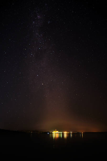 istock sky full of stars over a lake 1312708847