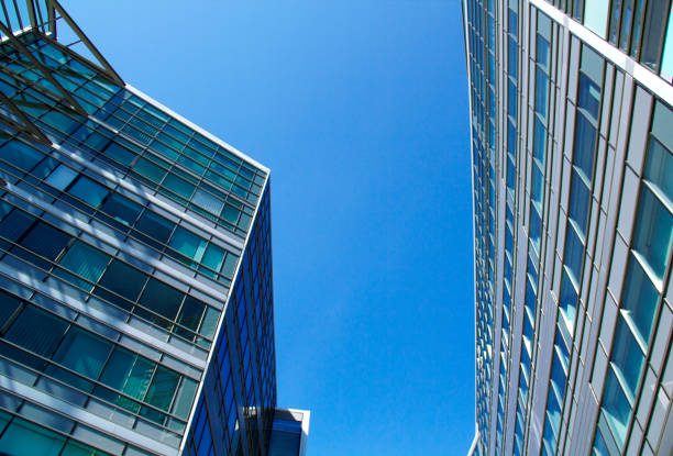 istock Financial Buildings Reflecting with Sunshine and Blue Sky 1312713611