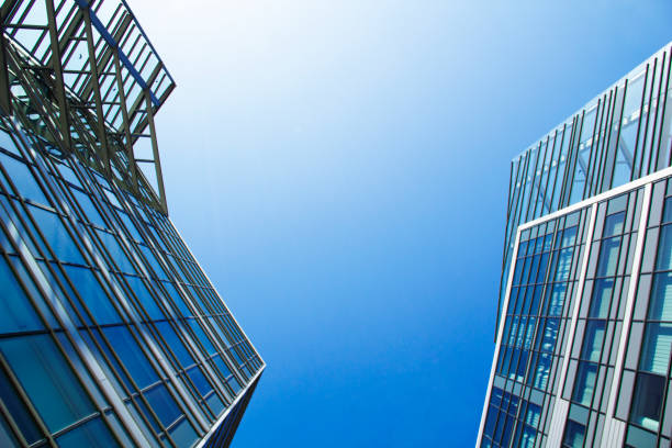 istock Financial Buildings Reflecting with Sunshine and Blue Sky 1312713612