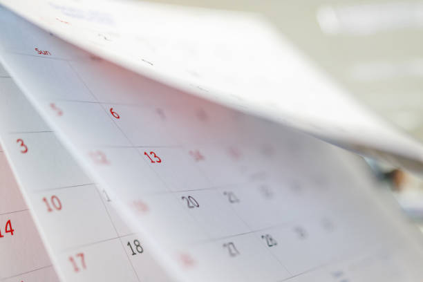 istock Calendar page flipping sheet close up on office table interior background business schedule planning appointment meeting concept 1312714708