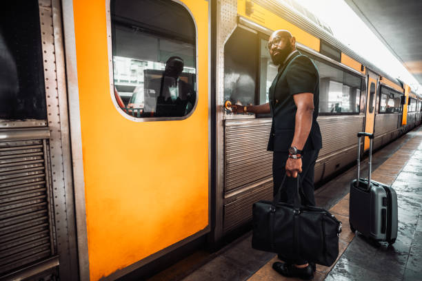 istock A black businessman entering a train 1312717475