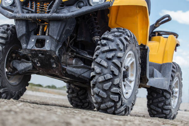 istock ATV on a dirt field in summer close-up 1312722944