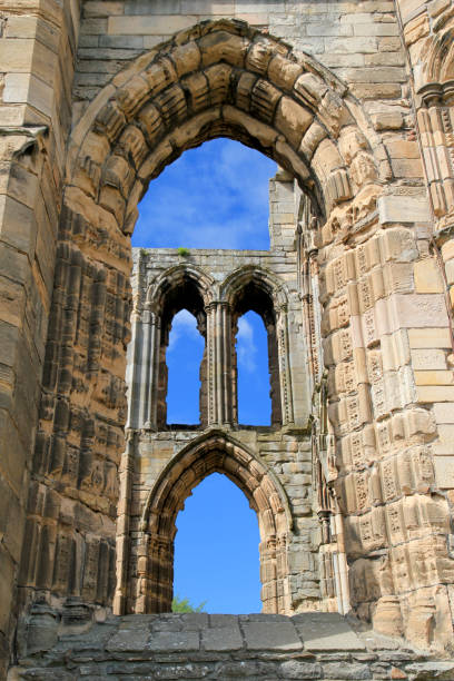 istock Blue Sky Behind Windows or Arches of Stone Castle Ruins 1312725836