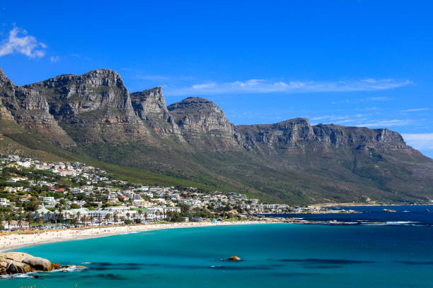 istock Beach and coastline with Mountains against blue sky in Cape Town 1312726396