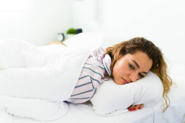 istock Sick attractive woman resting in her bedroom 1312734641