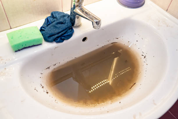 sink with dirty water because of the blockage. - dirty water imagens e fotografias de stock