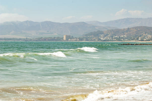 The shores of Ventura, California offer a unique background view of the Pacific Ocean.