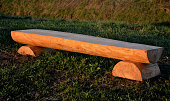 istock rustic bench made of halved debarked logs with legs made of logs 1312749006