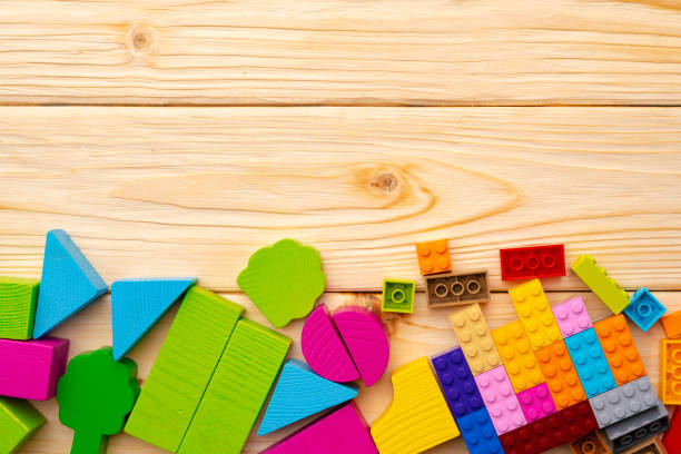 istock Toy constructor details on wooden background close up 1312749177
