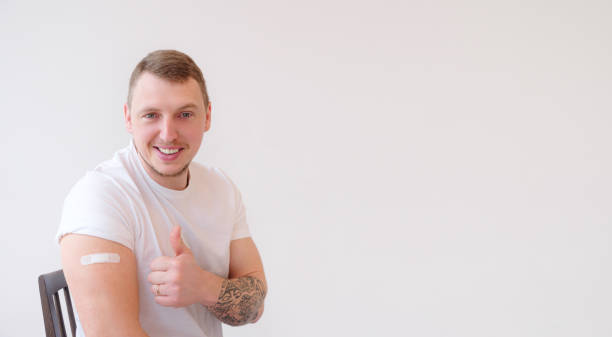 istock Caucasian Man smiling after receiving covid-19 vaccination. 1312749959