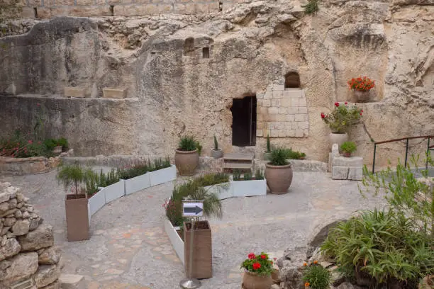 Photo of The Jesus Christ tomb in the Tomb Garden. Entrance to the Garden Tomb in Jerusalem, Israel.