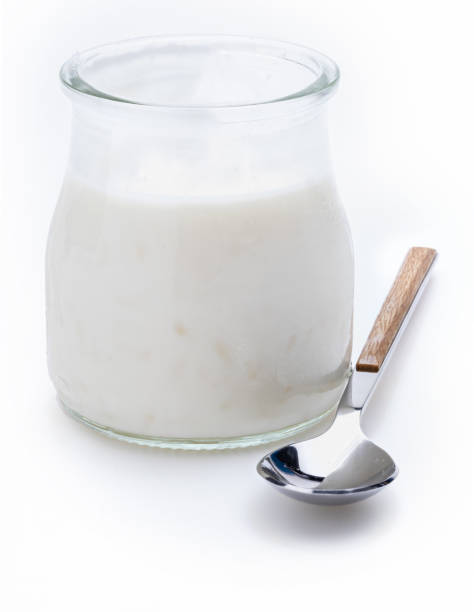 istock Delicate rice pudding in a glass (jar) and spoon. Ready to eat!. Isolated on white background. 1312755293