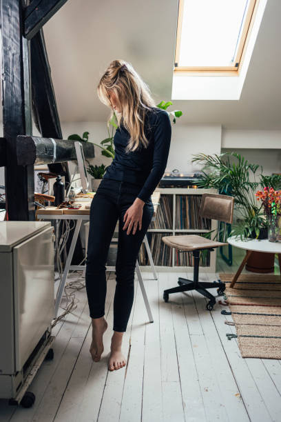 istock New Normal Concept- Young Beautiful Caucasian Woman Taking a Break while Working from Home 1312755478