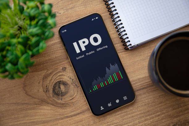 golden phone with IPO stocks purchase app on the screen stock photo