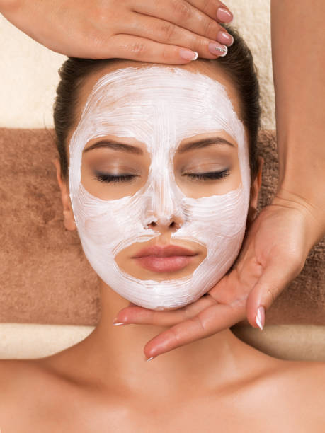 istock Woman with mask on her face having head massage. 1312756509
