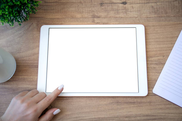 istock white computer tablet with isolated screen and female hand 1312756838