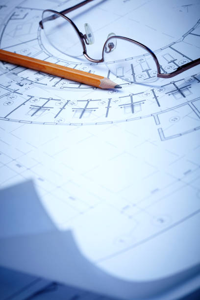istock architectural drawings, pencil and glasses. business, architecture, building, construction 1312757499