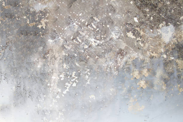 istock The wall is gray with scratches and damage on the surface close-up 1312759428