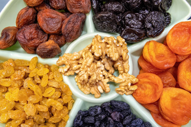 istock Dried fruits and nuts top view. 1312759546