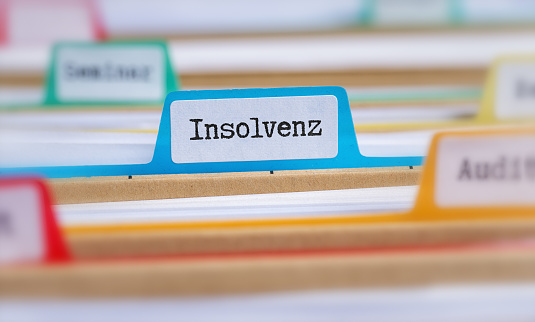 File folders with a tab labeled Insolvency in german - Insolvenz