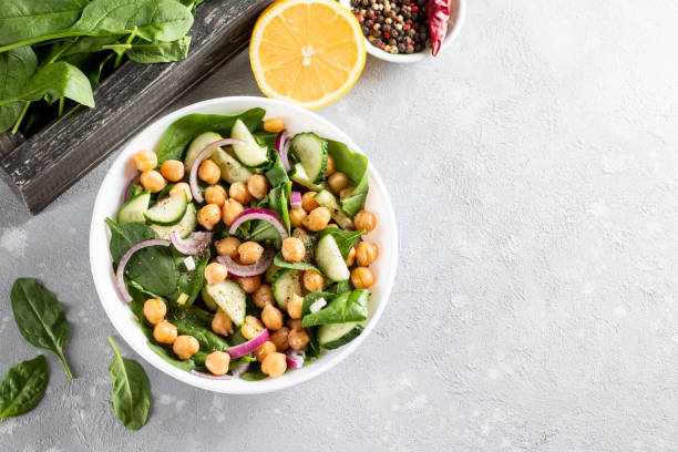istock Vegetable salad with chickpeas in a plate. Dietary food. Top view. Copy space. 1312763726