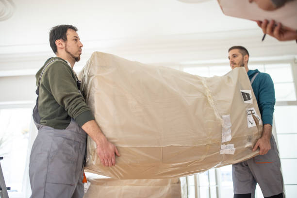 istock Workers moving the furniture into a new house 1312763749