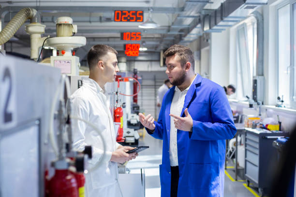 istock Engineer and technician discussing production process at factory 1312764323