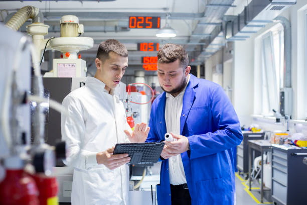 istock Engineer and technician discussing production process at factory 1312764399