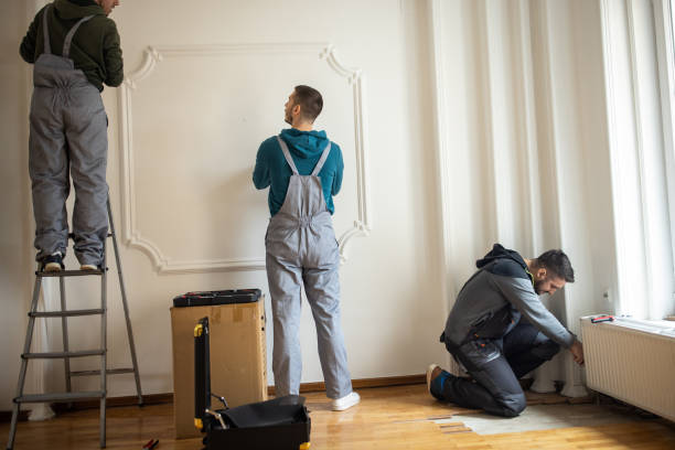 Repairman company employees working in clients home stock photo