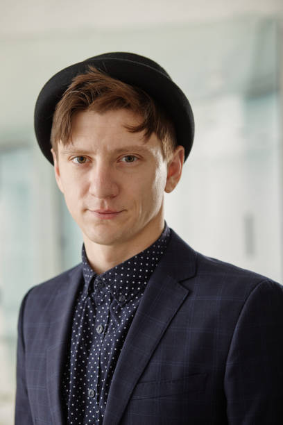 istock Confident handsome business man in suit and hat 1312765821