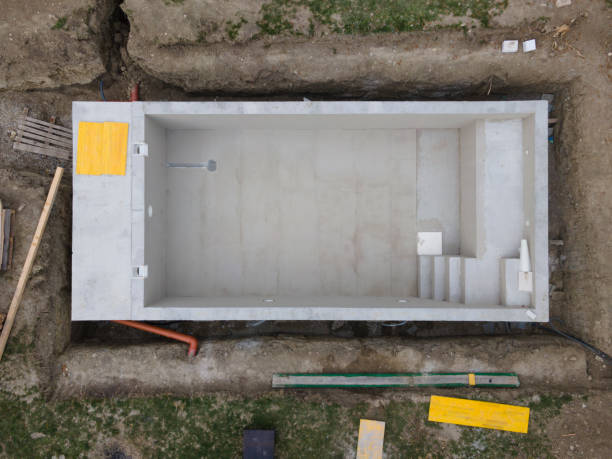 aerial drone shot of pool construction site almost finished spackling