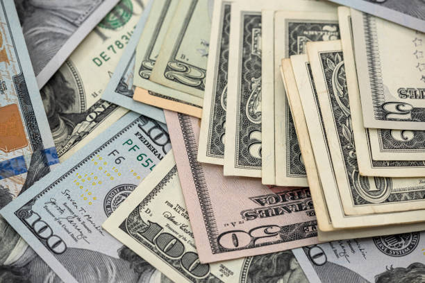 istock Close up view of money stack of 100 US dollars banknotes 1312768585