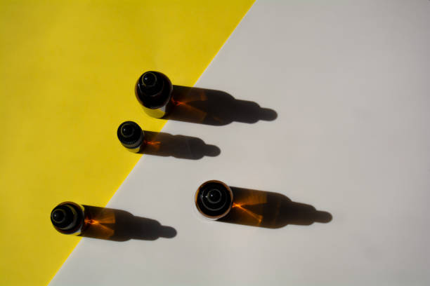 istock Set of bottles for cosmetics on yellow-white background 1312768683