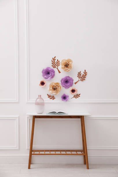 istock Stylish room interior with floral decor and table 1312769849