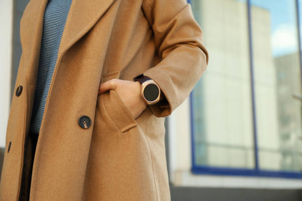 istock Mature woman with smart watch outdoors, closeup 1312769859