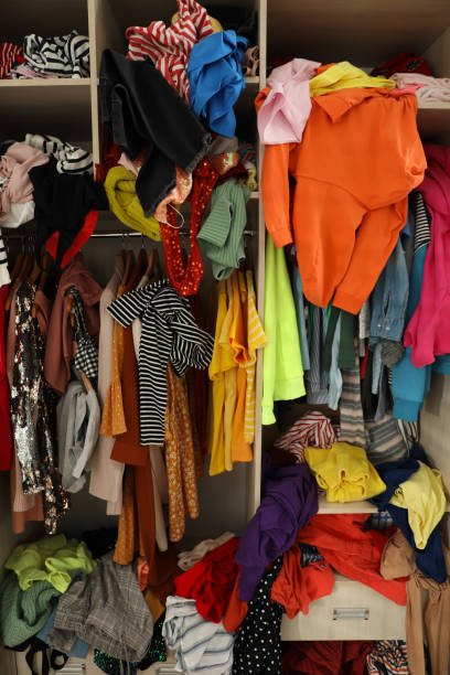 istock Messy wardrobe with different clothes. Fast fashion concept 1312769875