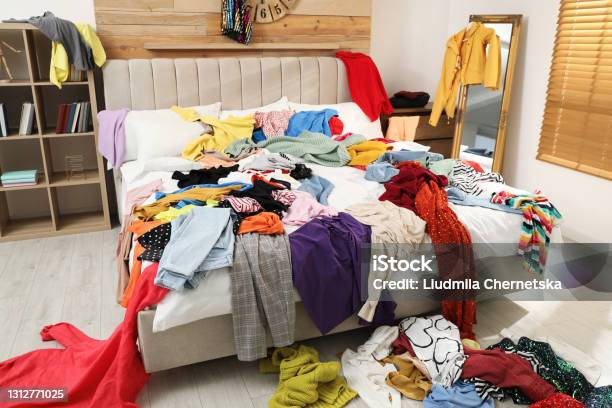 Pile Of Clothes On Bed In Messy Room Fast Fashion Concept Stock Photo - Download Image Now