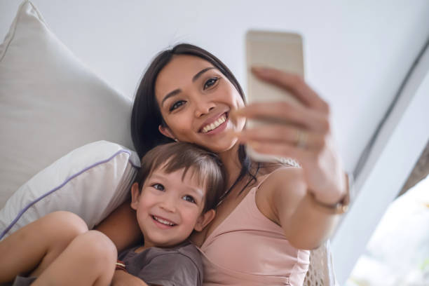 istock Indonesian Mother and Her Mixed-Race Son Having a Selfie 1312772879