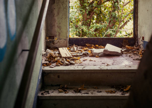 Autumn leaves on steps in abandoned place