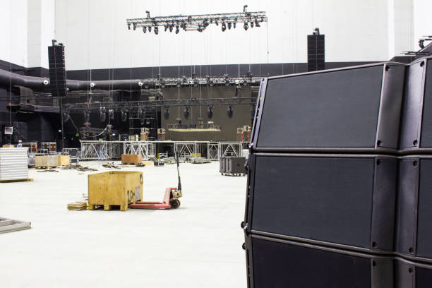 istock Line array speakers. Stage, trusses, led screen and sound speakers background. Installation of professional concert equipment. 1312780264