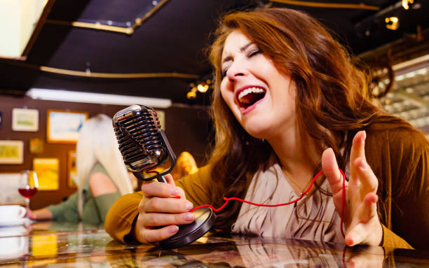 istock Woman singing with microphone 1312781505