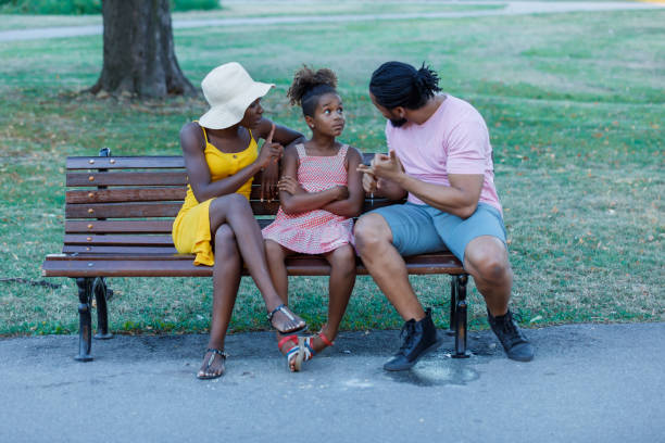 istock An African Family is Talking About the Problems in Public Park. 1312781619