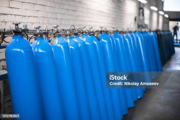 Oxygen Cylinder With Compressed Gas Blue Oxygen Tanks For Industry Liquefied Oxygen Production Factory Stock Photo - Download Image Now