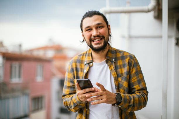 istock Young Man With Smart Phone In Sunny Weather 1312783145
