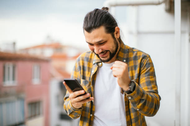 istock Young Man With Smart Phone In Sunny Weather 1312783590