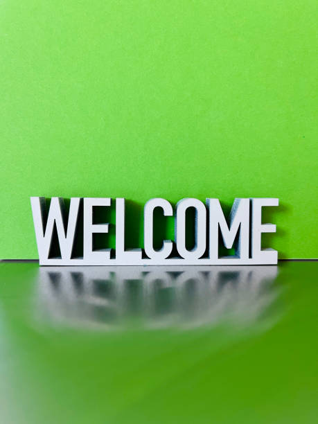 istock Welcome sign on green background 1312783863