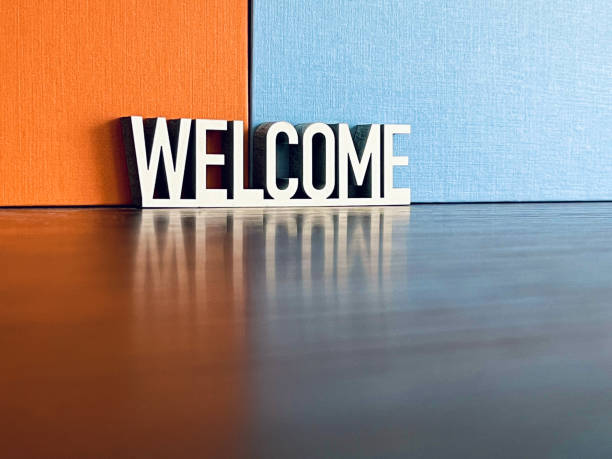 istock Welcome sign on orange blue background 1312783885